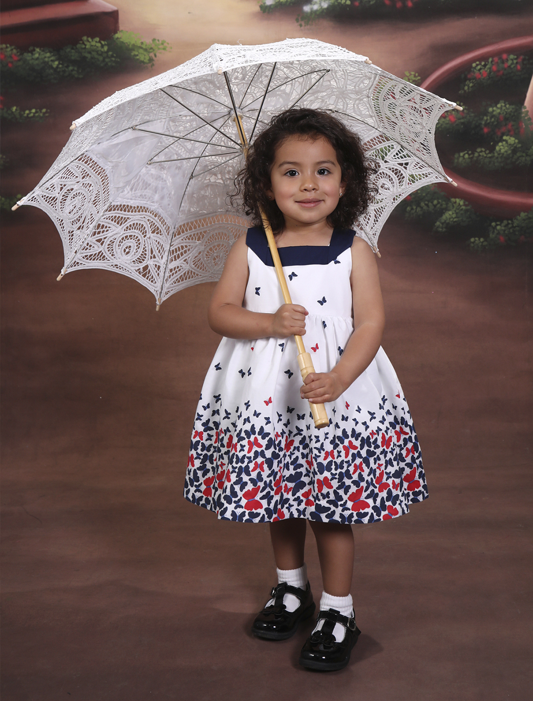 Girl portrait with a white umbrella and dress