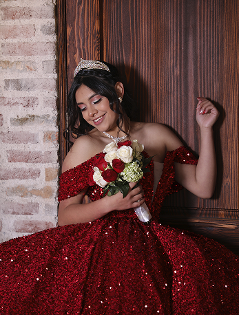 XV Años portrait next to wooden door