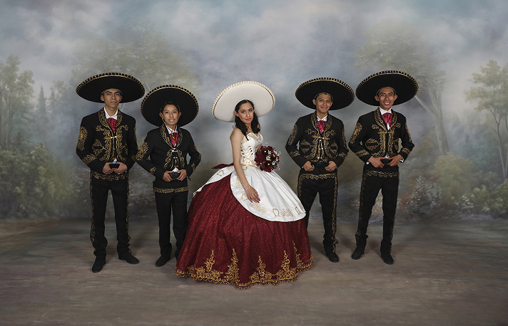 XV Años studio portrait with traditional mariachi attire